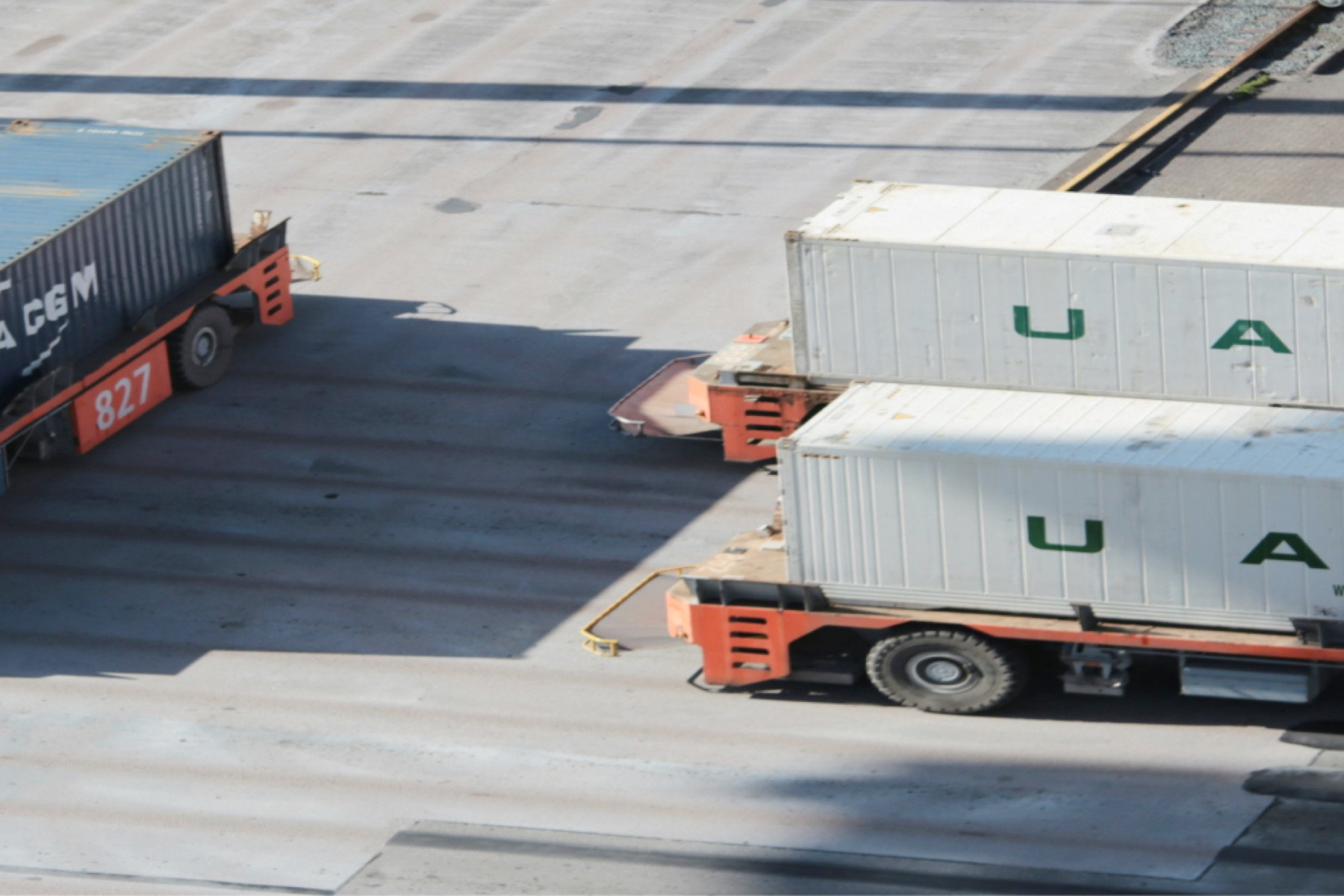 Containers on trucks in a port yard